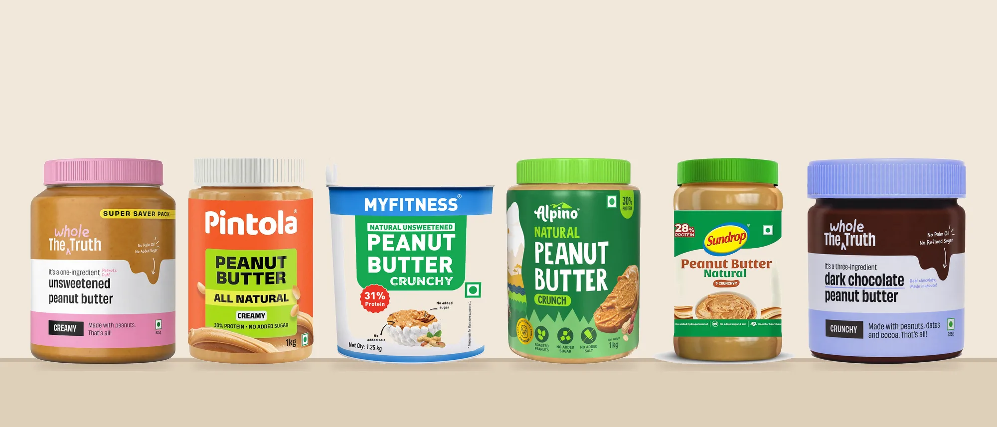 Six of our ten picks on a shelf: The Whole Truth Unsweetened, Pintola All Natural, MyFitness Natural, Alpino Natural, Sundrop Natural and The Whole Truth Dark Chocolate peanut butter